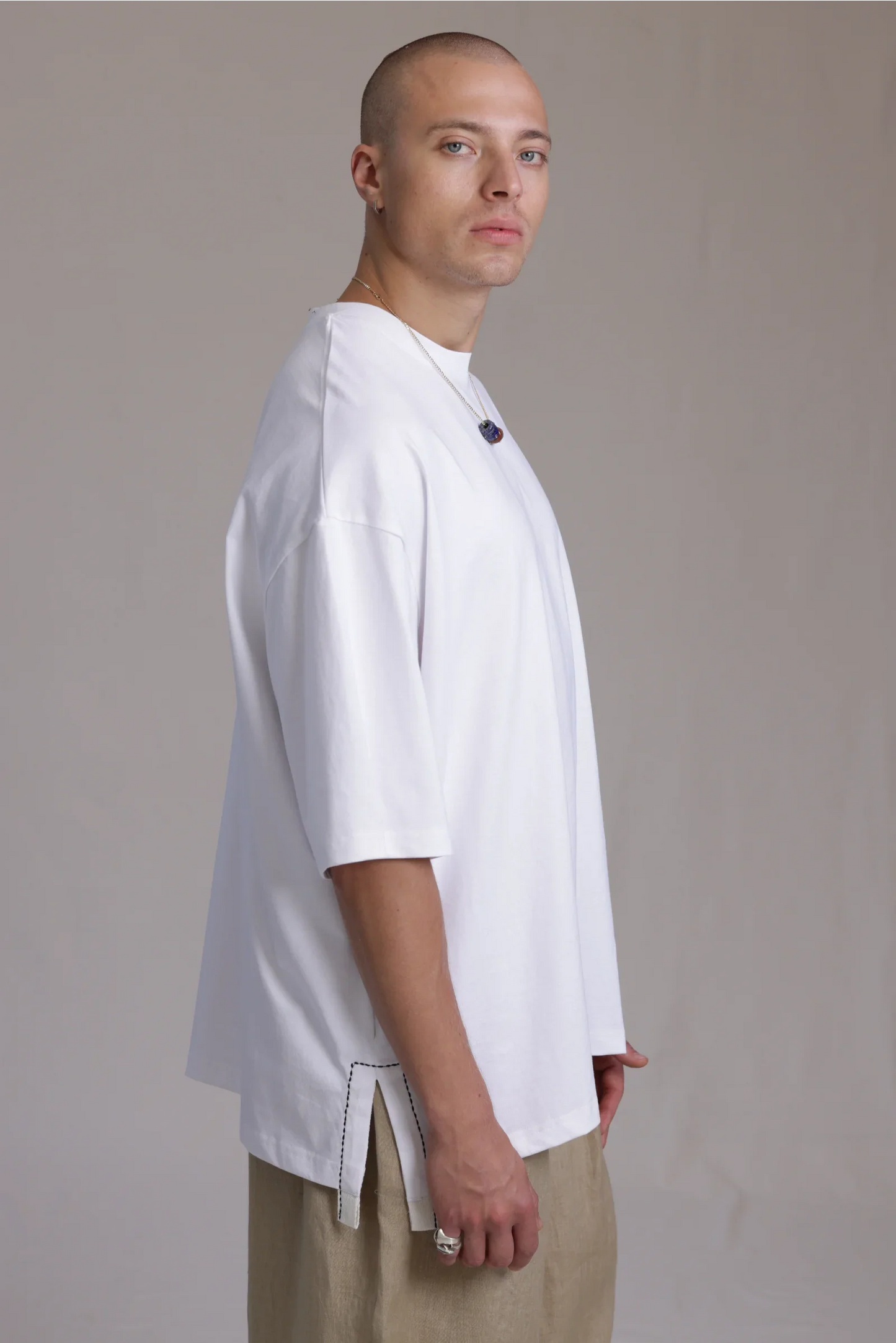 ALBI Sapan Shirt, an oversized short sleeve cotton jersey tee with hand-stitched side slits