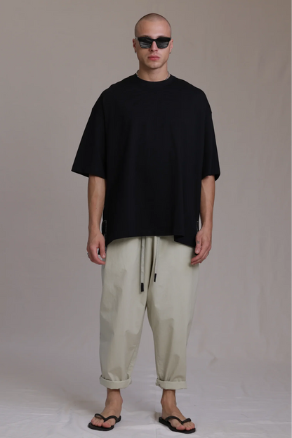 ALBI Sapan Shirt, an oversized short sleeve cotton jersey tee with hand-stitched side slits