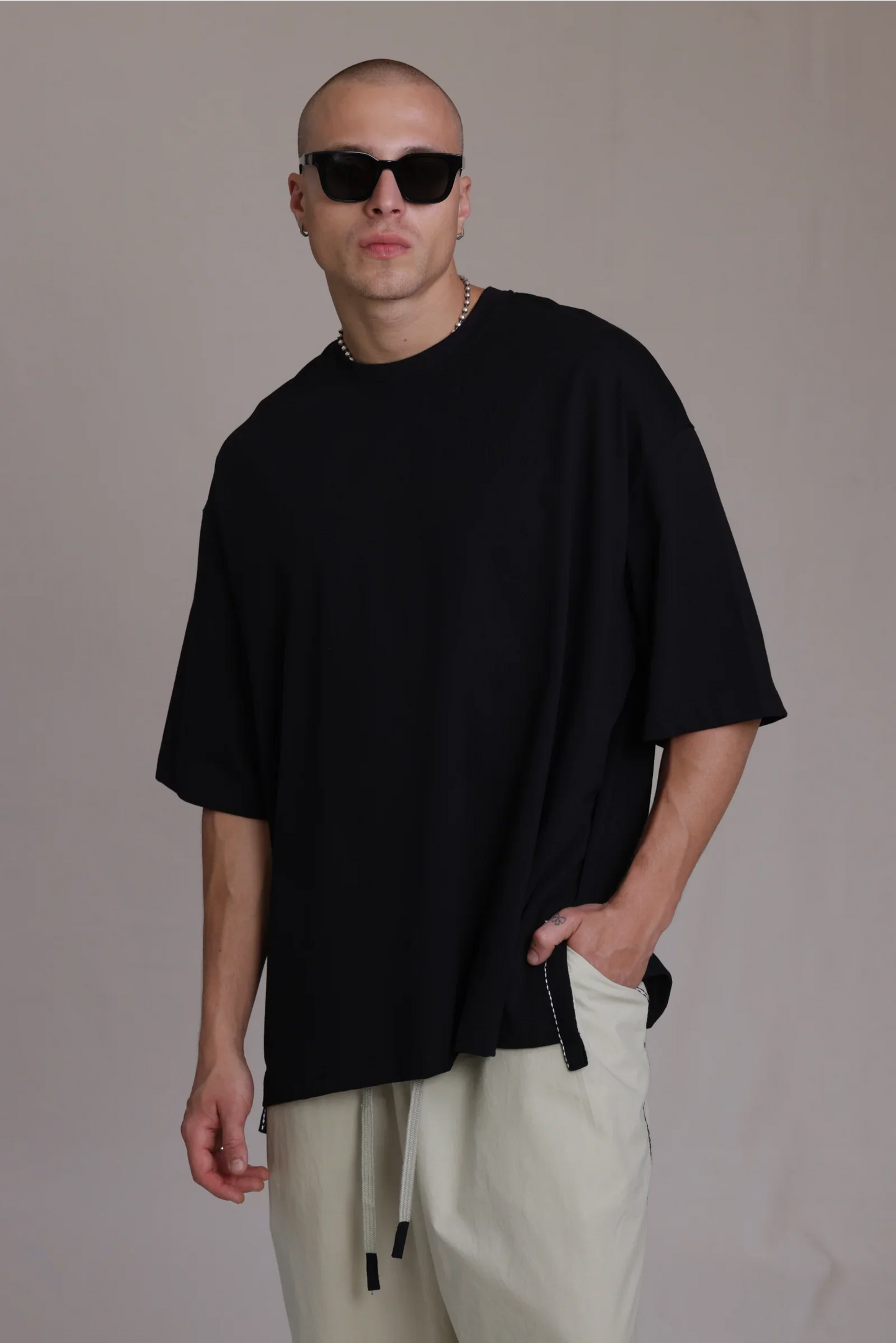 ALBI Sapan Shirt, an oversized short sleeve cotton jersey tee with hand-stitched side slits