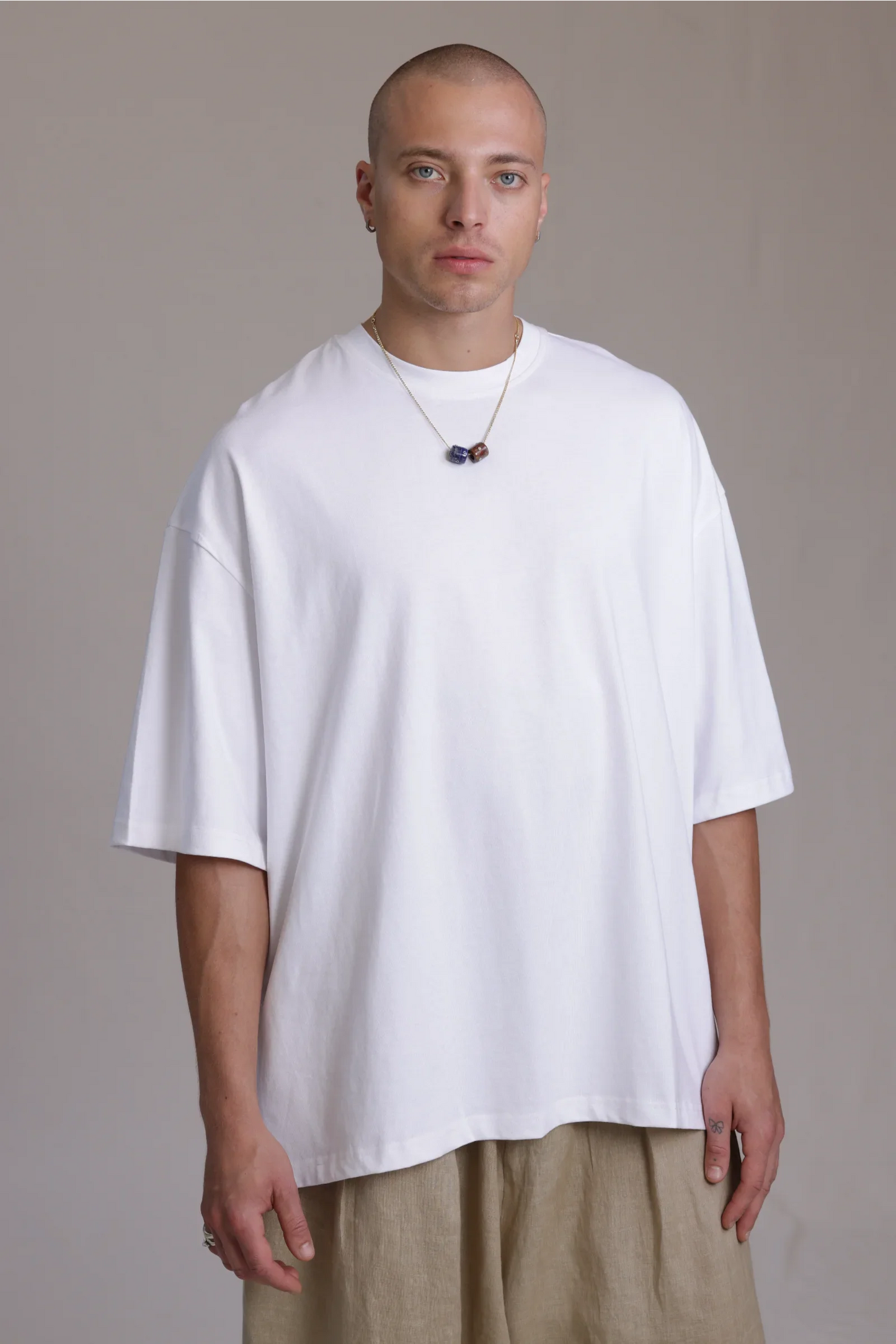 ALBI Sapan Shirt, an oversized short sleeve cotton jersey tee with hand-stitched side slits