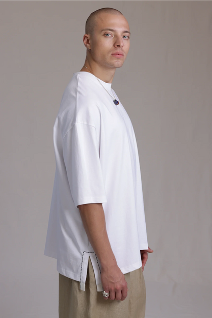 ALBI Sapan Shirt, an oversized short sleeve cotton jersey tee with hand-stitched side slits