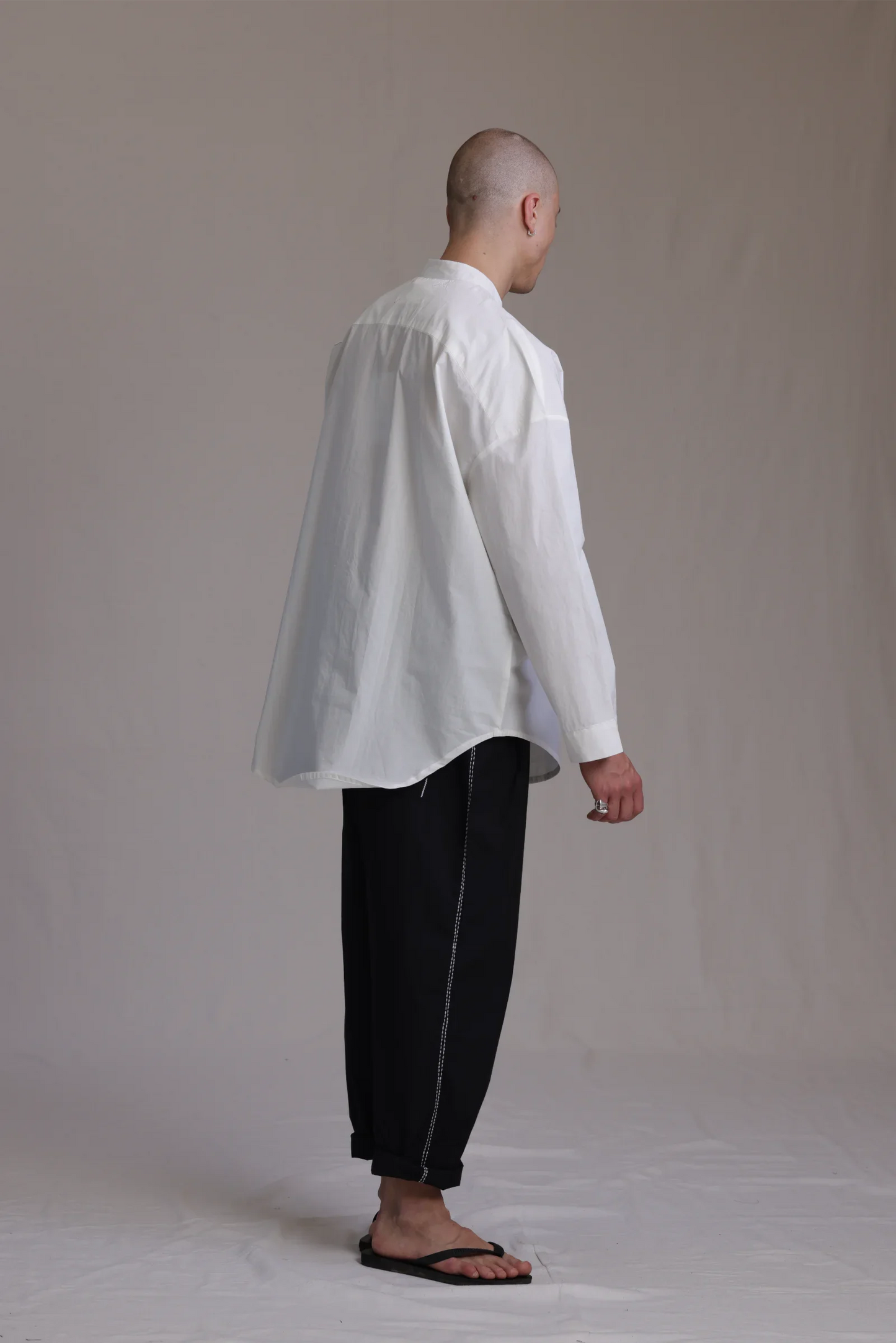 ALBI Rin Shirt, an oversized cotton poplin band collar shirt with tonal hand-stitched detailing