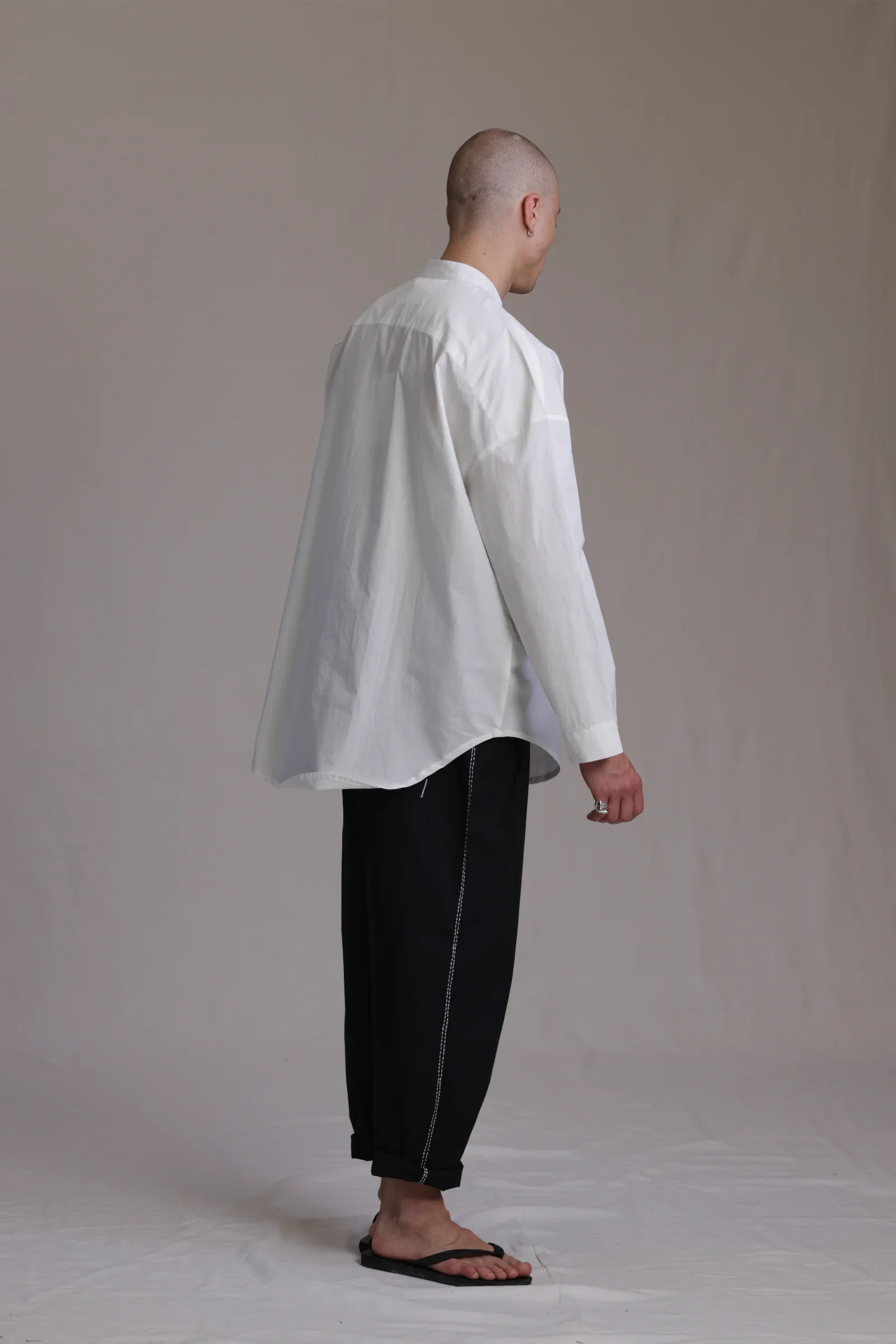 ALBI Rin Shirt, an oversized cotton poplin band collar shirt with tonal hand-stitched detailing
