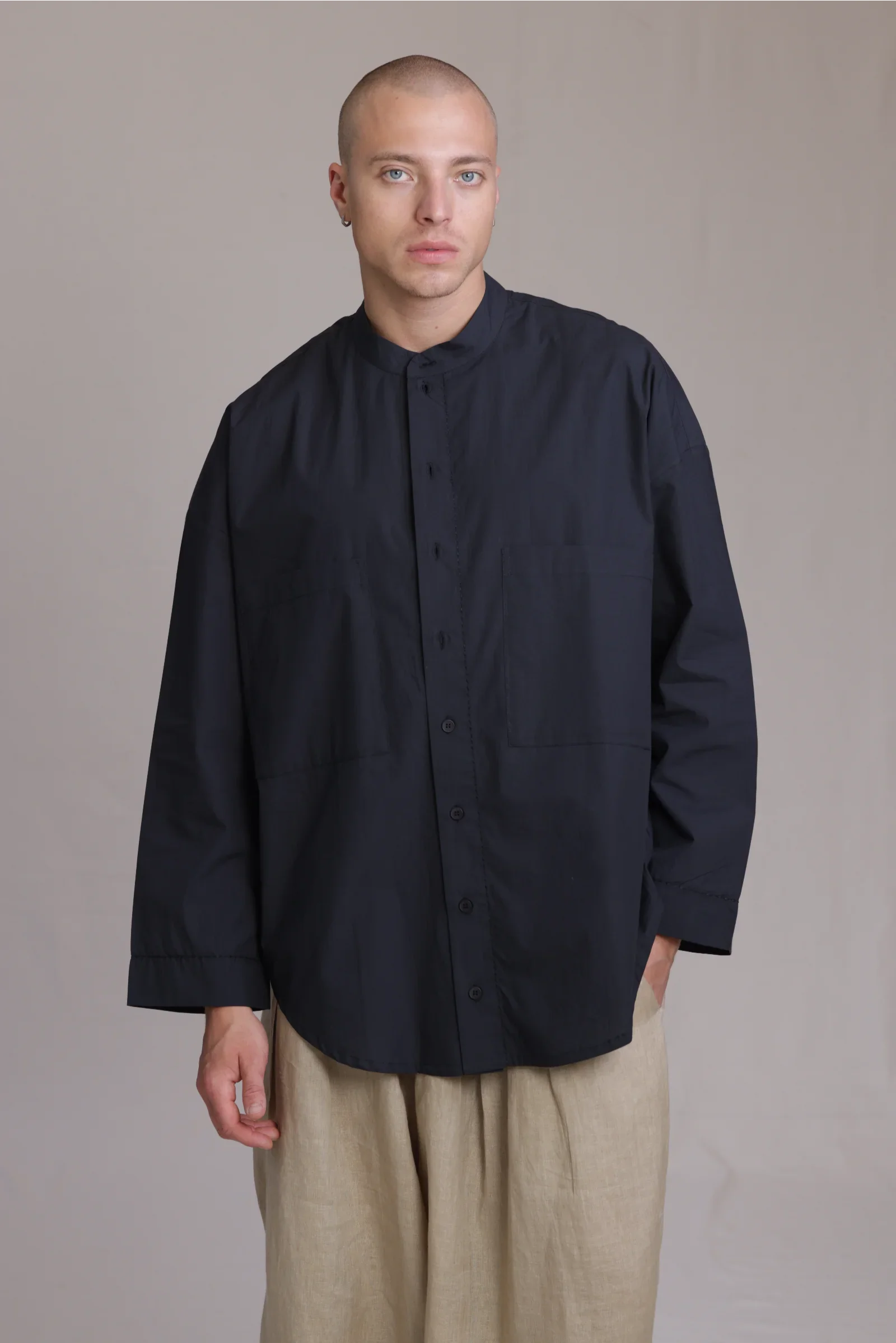 ALBI Rin Shirt, an oversized cotton poplin band collar shirt with tonal hand-stitched detailing