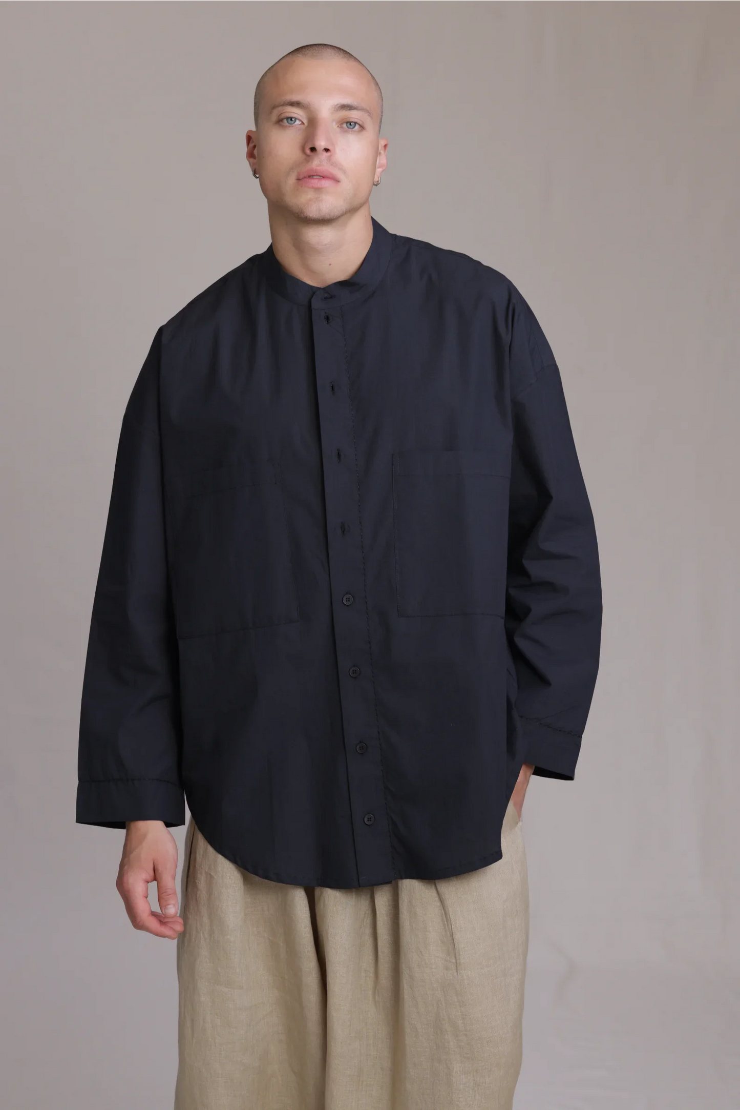 ALBI Rin Shirt, an oversized cotton poplin band collar shirt with tonal hand-stitched detailing