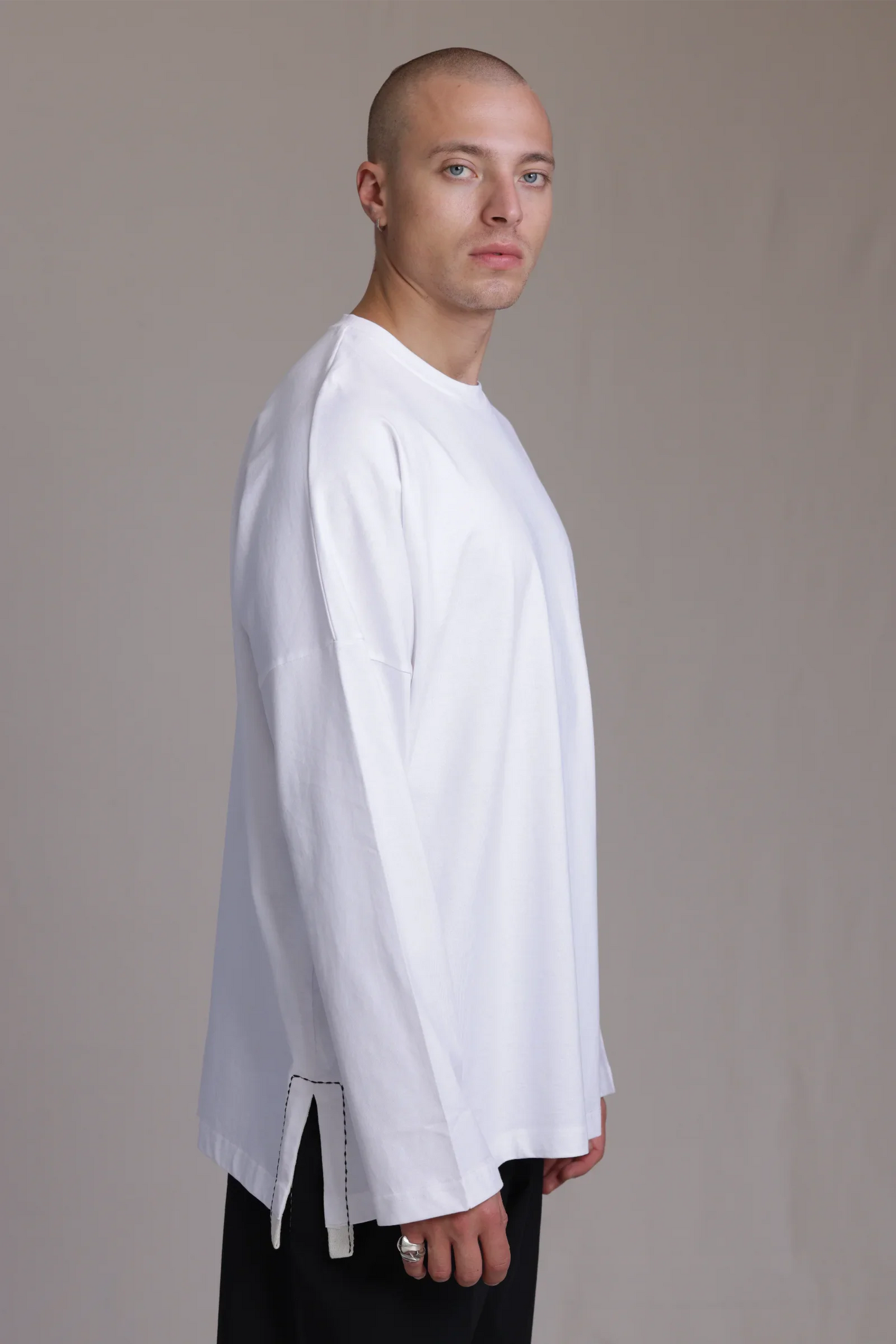 ALBI Michi Shirt, an oversized long sleeve cotton jersey tee with hand-stitched side slits