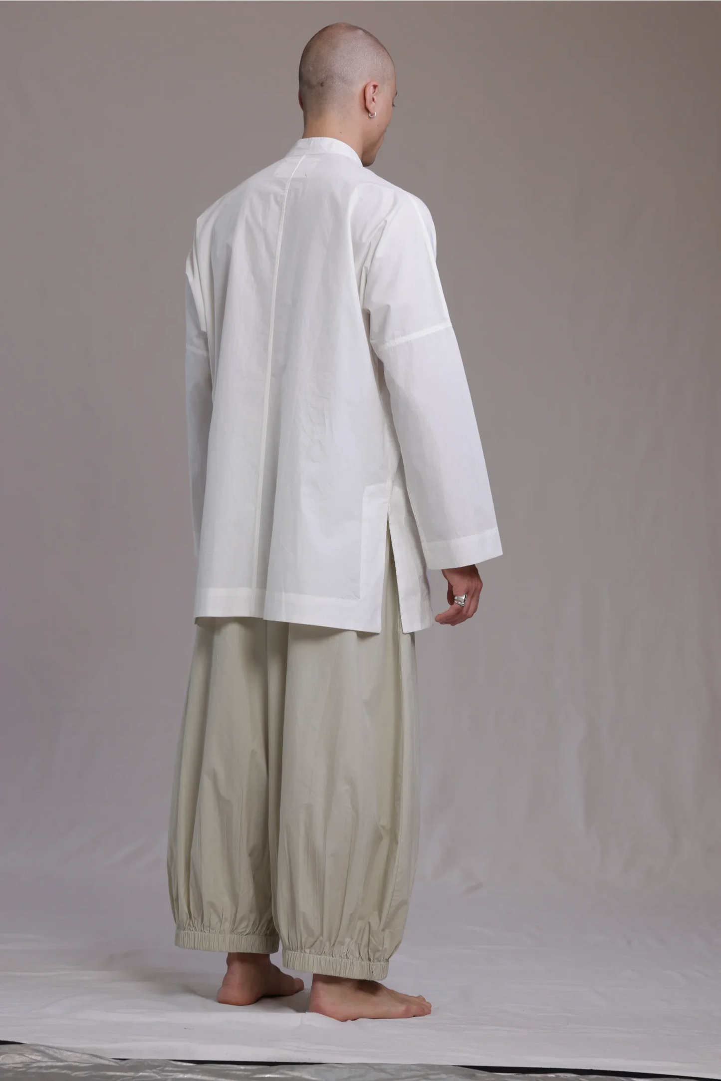 ALBI Sei Shirt, a long oversized cotton poplin band collar shirt with low patch pockets