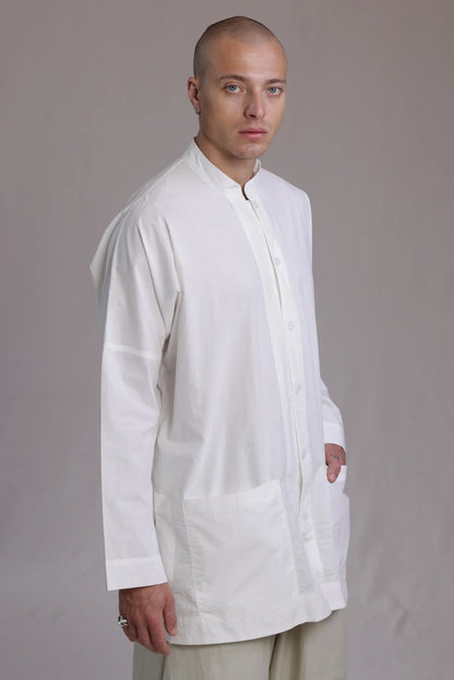 ALBI Sei Shirt, a long oversized cotton poplin band collar shirt with low patch pockets