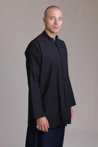 ALBI Sei Shirt, a long oversized cotton poplin band collar shirt with low patch pockets