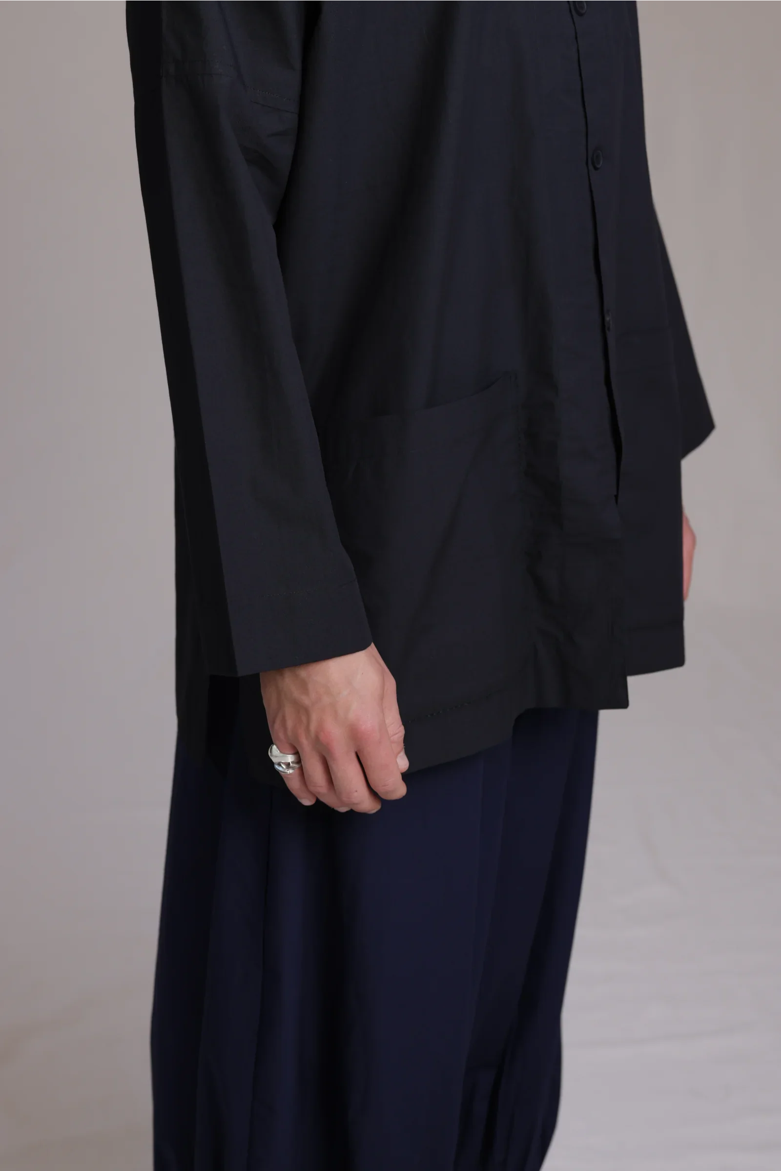 ALBI Sei Shirt, a long oversized cotton poplin band collar shirt with low patch pockets