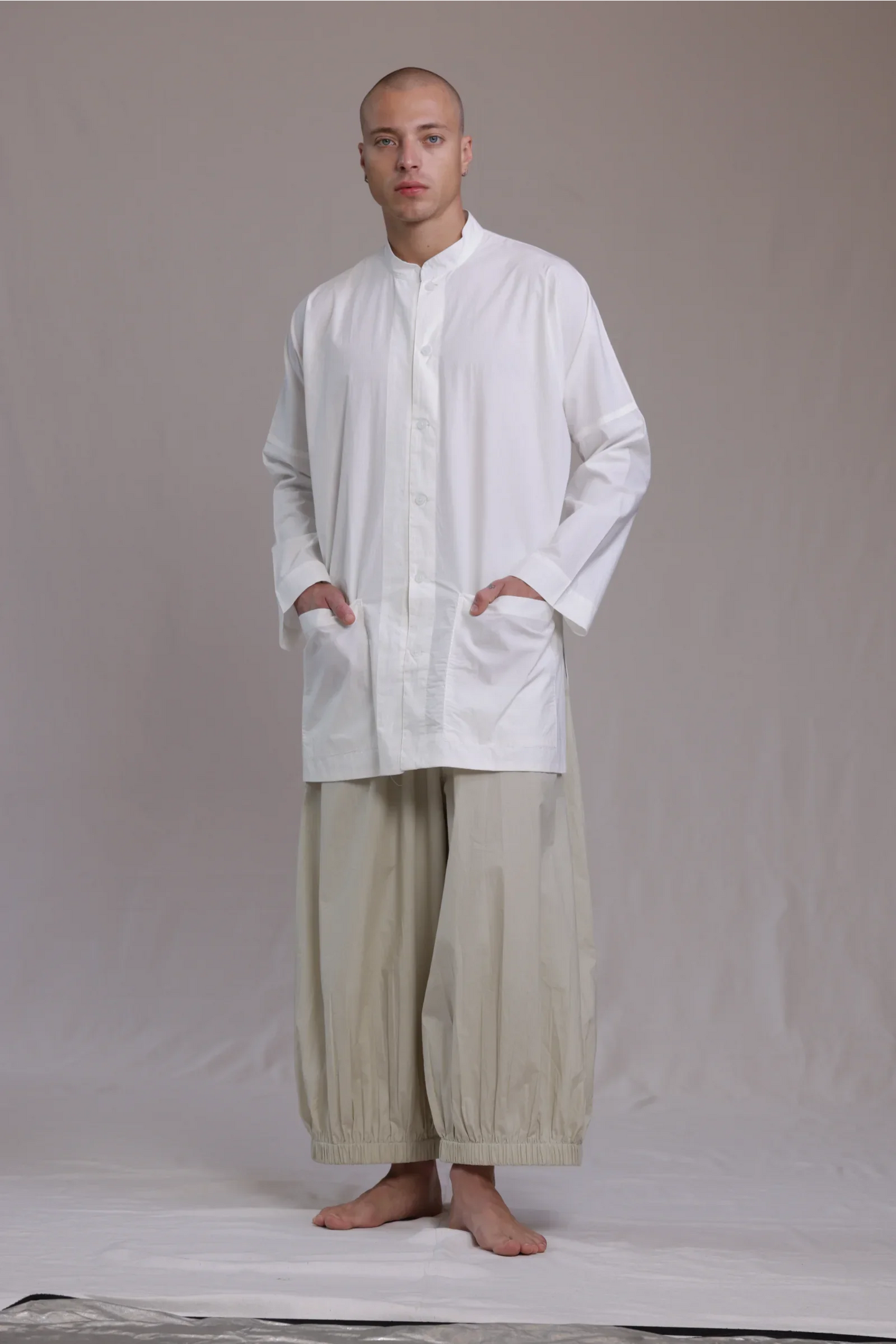 ALBI Sei Shirt, a long oversized cotton poplin band collar shirt with low patch pockets