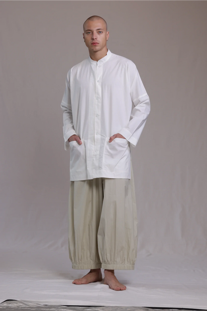 ALBI Sei Shirt, a long oversized cotton poplin band collar shirt with low patch pockets